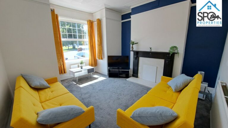 Modern living room in Newport contractor accommodation with HD Smart TV.